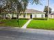Single-story house with a well-maintained lawn and walkway at 123 Gulf Dr, Kissimmee, FL 34759