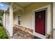 Inviting front door entry with a covered porch at 123 Gulf Dr, Kissimmee, FL 34759