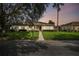 Charming one-story home with landscaped yard and two-car garage at 123 Gulf Dr, Kissimmee, FL 34759