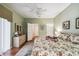 Main bedroom with floral bedding and en-suite bathroom access at 123 Gulf Dr, Kissimmee, FL 34759