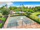 Community basketball court with pool in background at 9107 Savannah Ainsley Ln, Orlando, FL 32832