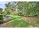 Spacious backyard with a patio and lush green grass at 26 Cedar Dr, Davenport, FL 33837