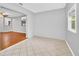 Bright dining room with hardwood floors and a modern chandelier at 26 Cedar Dr, Davenport, FL 33837