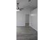 Living room with gray flooring and an open doorway to another room at 411 Gannet Ct, Kissimmee, FL 34759