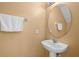 Small half bathroom with pedestal sink at 121 Madiera Beach Blvd, Kissimmee, FL 34746