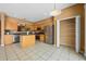 Kitchen with island, stainless steel appliances and light wood cabinets at 121 Madiera Beach Blvd, Kissimmee, FL 34746