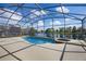 Relaxing poolside view overlooking a peaceful lake at 121 Madiera Beach Blvd, Kissimmee, FL 34746