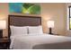 Cozy bedroom with a comfortable bed and stylish artwork at 14501 Grove Resort Ave # 3439, Winter Garden, FL 34787