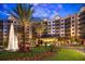 Resort-style building with fountain and landscaping at 14501 Grove Resort Ave # 3439, Winter Garden, FL 34787