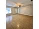 Spacious living room with tile flooring and ceiling fan at 1940 Tripaul Ct, Bartow, FL 33830