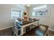 Bright dining area with a table and bench seating for four at 872 Sydney St, Davenport, FL 33837