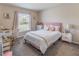 Charming bedroom with a pink theme, vanity, and plenty of natural light at 872 Sydney St, Davenport, FL 33837