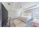 Main bedroom with ample space, ceiling fan, and a large TV at 872 Sydney St, Davenport, FL 33837