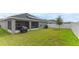 Spacious backyard with covered patio, perfect for outdoor entertaining at 872 Sydney St, Davenport, FL 33837