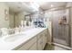 Modern bathroom with double sinks, and a separate shower at 872 Sydney St, Davenport, FL 33837