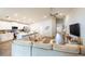 Open concept living room and kitchen with a large sectional sofa at 872 Sydney St, Davenport, FL 33837