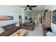 Open living room with couches, coffee table and kitchen view at 1652 Dunes Ct, Haines City, FL 33844