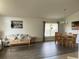 Open concept dining area with a wooden table and chairs at 1652 Dunes Ct, Haines City, FL 33844