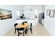 Open kitchen with white cabinets and a breakfast bar at 1652 Dunes Ct, Haines City, FL 33844