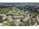 Aerial view of apartment community with pool and tennis court at 4768 Walden Cir # 327, Orlando, FL 32811