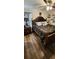 Spacious bedroom with large bed and wood flooring at 4768 Walden Cir # 327, Orlando, FL 32811