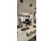 Modern kitchen with white cabinets, quartz countertops, and pendant lights at 4768 Walden Cir # 327, Orlando, FL 32811
