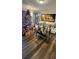 Living room features hardwood floors, a Christmas tree, and white couch at 4768 Walden Cir # 327, Orlando, FL 32811