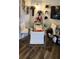 Small dining area with glass table, white chairs, and festive decor at 4768 Walden Cir # 327, Orlando, FL 32811