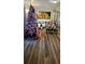Living room featuring a decorated Christmas tree and hardwood floors at 4768 Walden Cir # 327, Orlando, FL 32811