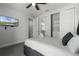 Bedroom with a queen bed, TV, and spacious closet at 451 Lasso Dr, Kissimmee, FL 34747