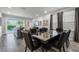 Modern dining area with glass-top table and dark gray chairs at 451 Lasso Dr, Kissimmee, FL 34747