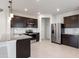 Modern kitchen with stainless steel appliances and granite countertops at 4523 Cypress Cay Way, Kissimmee, FL 34746