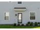 Private entrance with modern door and landscaping at 4523 Cypress Cay Way, Kissimmee, FL 34746