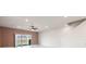 Bright living room with sliding glass doors leading to a lake view at 4523 Cypress Cay Way, Kissimmee, FL 34746