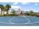 Community basketball court with playground visible in the background at 4523 Cypress Cay Way, Kissimmee, FL 34746
