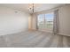 Elegant bedroom featuring a chandelier and large windows at 4523 Cypress Cay Way, Kissimmee, FL 34746