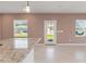 Kitchen features granite countertops and access to backyard at 4523 Cypress Cay Way, Kissimmee, FL 34746