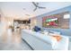 Open living area with white couch and kitchen view at 1157 Challenge Dr # 1157, Davenport, FL 33896