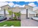 Modern townhome with two-car garage and landscaped front yard at 1157 Challenge Dr # 1157, Davenport, FL 33896