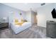 Spacious Primary bedroom with plush bed, nightstands, and en-suite bathroom access at 1157 Challenge Dr # 1157, Davenport, FL 33896