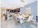 Modern kitchen with dark cabinetry, island, and stainless steel appliances at 1157 Challenge Dr # 1157, Davenport, FL 33896