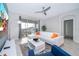 Living room with white sectional sofa and large TV at 1157 Challenge Dr # 1157, Davenport, FL 33896