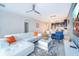 Open living room featuring a sectional sofa, large TV, and adjacent dining area at 1157 Challenge Dr # 1157, Davenport, FL 33896