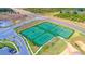 Aerial view of six well-maintained tennis courts at 1157 Challenge Dr # 1157, Davenport, FL 33896