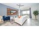 Living room with white sectional sofa, large TV, and balcony access at 1157 Challenge Dr # 1157, Davenport, FL 33896