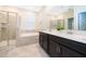 Elegant bathroom with double vanity, soaking tub, and walk-in shower at 1157 Challenge Dr # 1157, Davenport, FL 33896
