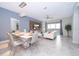 Open concept dining room with modern table and chairs at 1157 Challenge Dr # 1157, Davenport, FL 33896