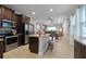 Modern kitchen with stainless steel appliances, granite counters, and island at 7617 Brookhurst Ln, Kissimmee, FL 34747