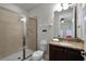 Bathroom with shower, toilet and granite vanity at 7617 Brookhurst Ln, Kissimmee, FL 34747