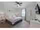 Main bedroom with king-size bed and private closet at 7617 Brookhurst Ln, Kissimmee, FL 34747
